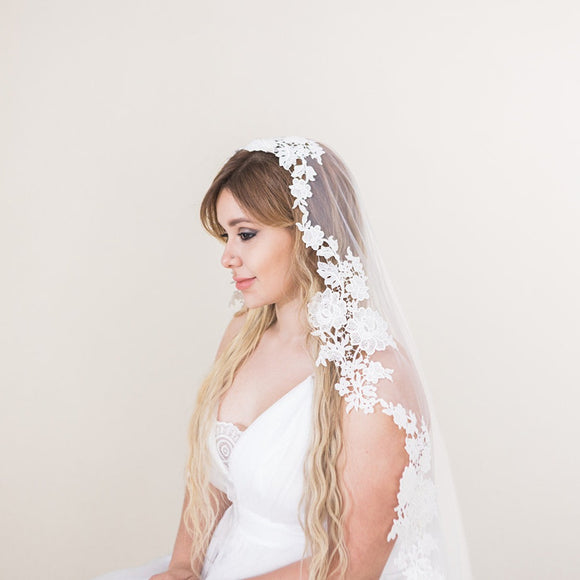 https://cdn.shopify.com/s/files/1/0768/3307/files/olivia-mantilla-veil-from-spain.jpg?v=1687551135&width=580