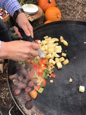 potato and sausage being cooked