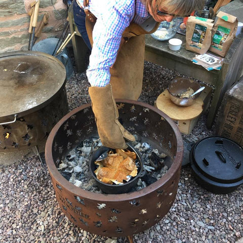 Woman cooking bread in woodee