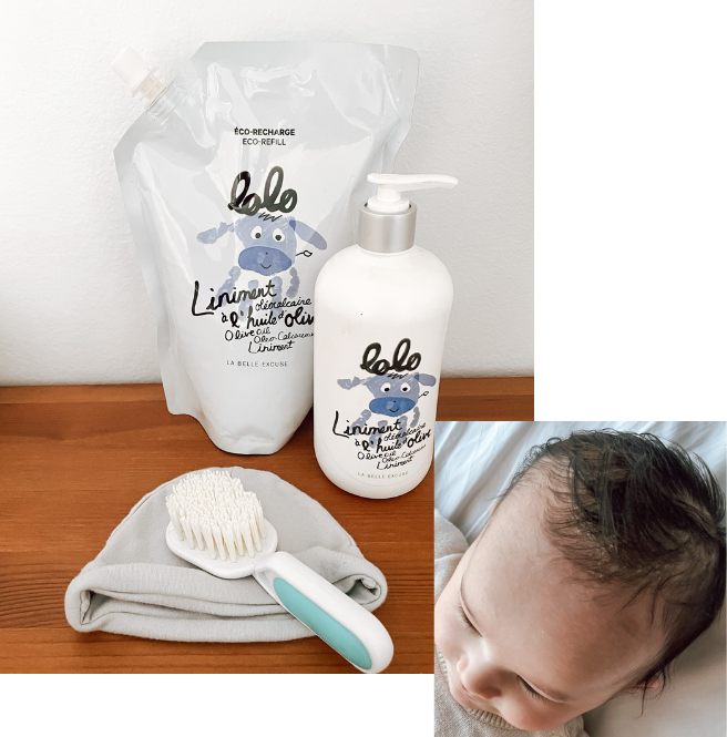 bébé avec du chapeau et le liniment oléocalcaire