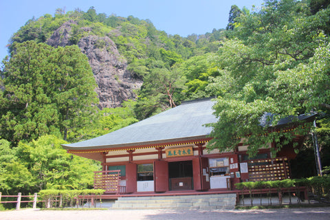 Horaiji Temple main building with Kagami-Iwa, mirror rock, behind.