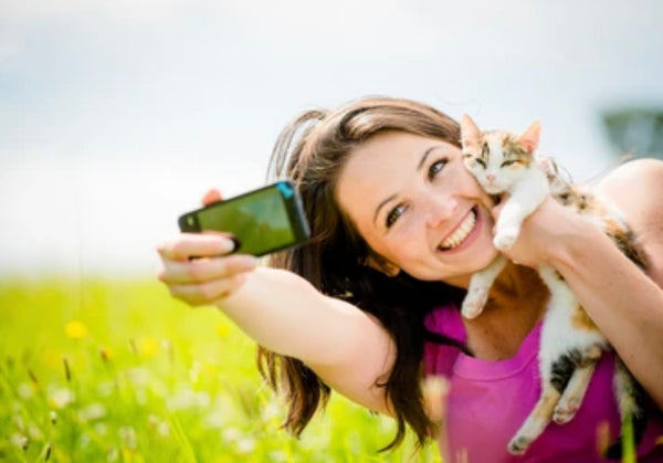 woman getting a selfie with her cat