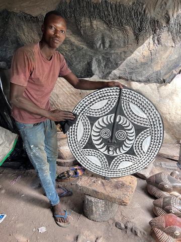 Artisan making a Sun mask in Ivory Coast