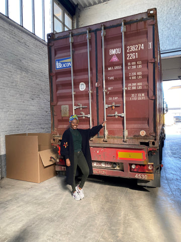 Claudine receiving a container at the warehouse in Belgium