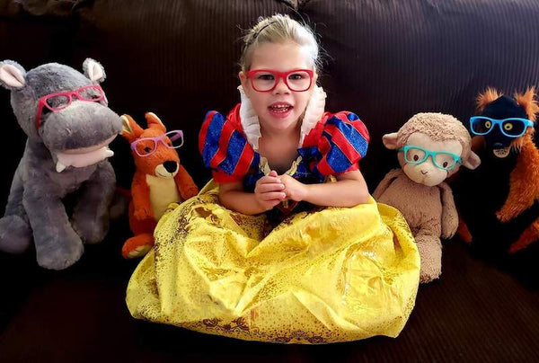 girl dressed as snow white wearing red glasses