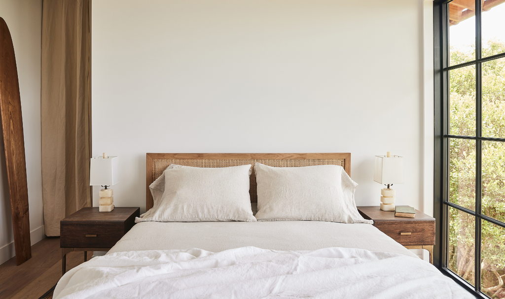 Linen bedding styled in a bedroom