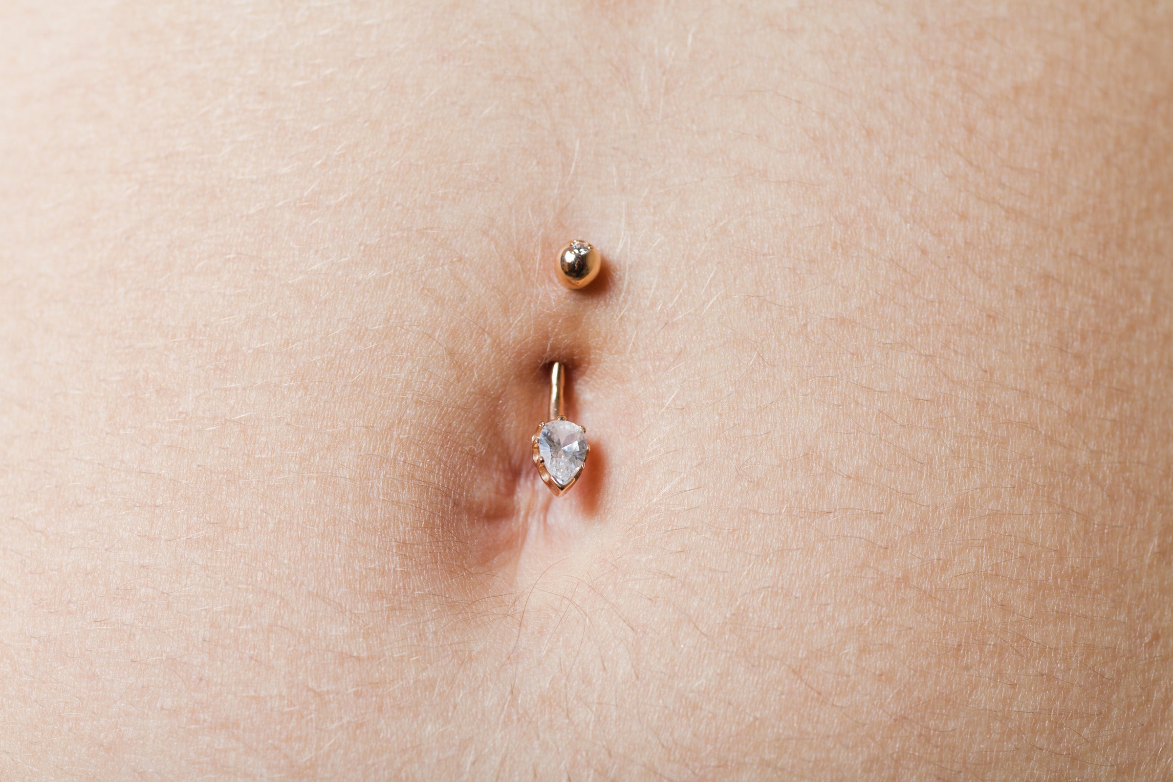 Heal Time & Factors for Belly Button Piercings