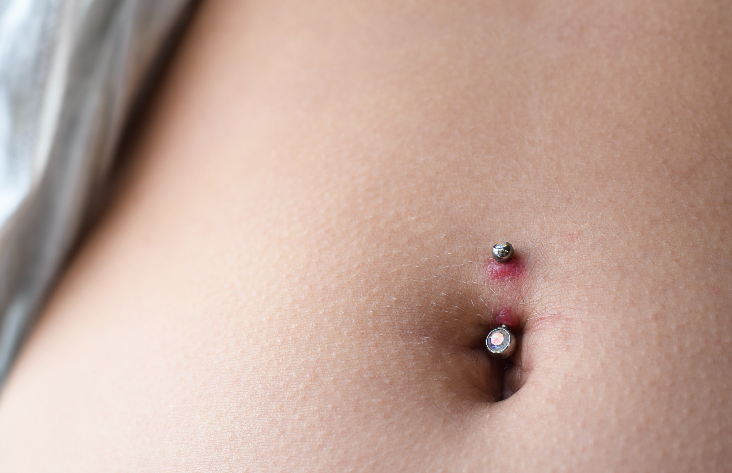 Reasons for removing belly button piercings