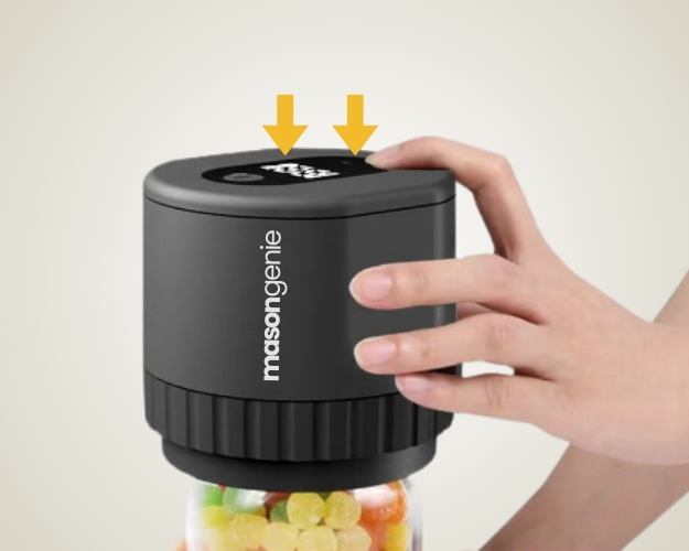 Hand operating a black lid on a candy jar with digital interface.