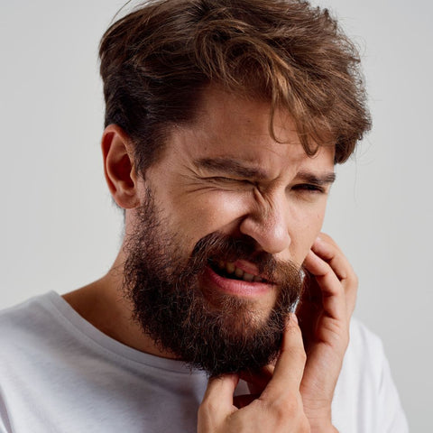 man with toothache for blog post 8 dangers of bad dental health. WhiteWaveSmile, home of best dental products.