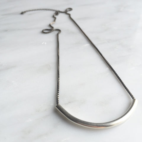 the ANJA Pipe necklace in oxidised silver and unpolished matt finished sterling silver.
