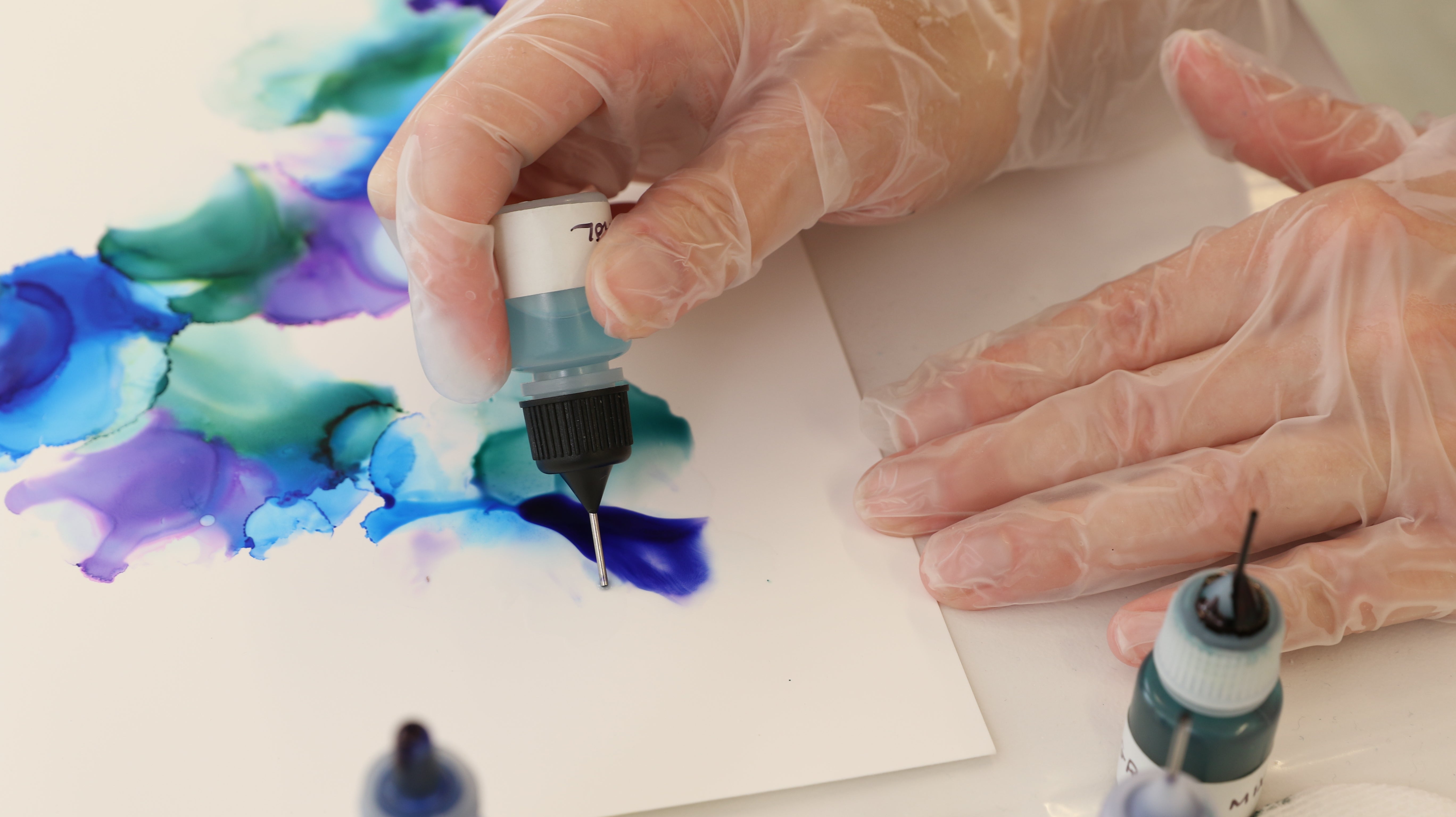 use isopropyl alcohol on edge of alcohol ink painting to create a fade