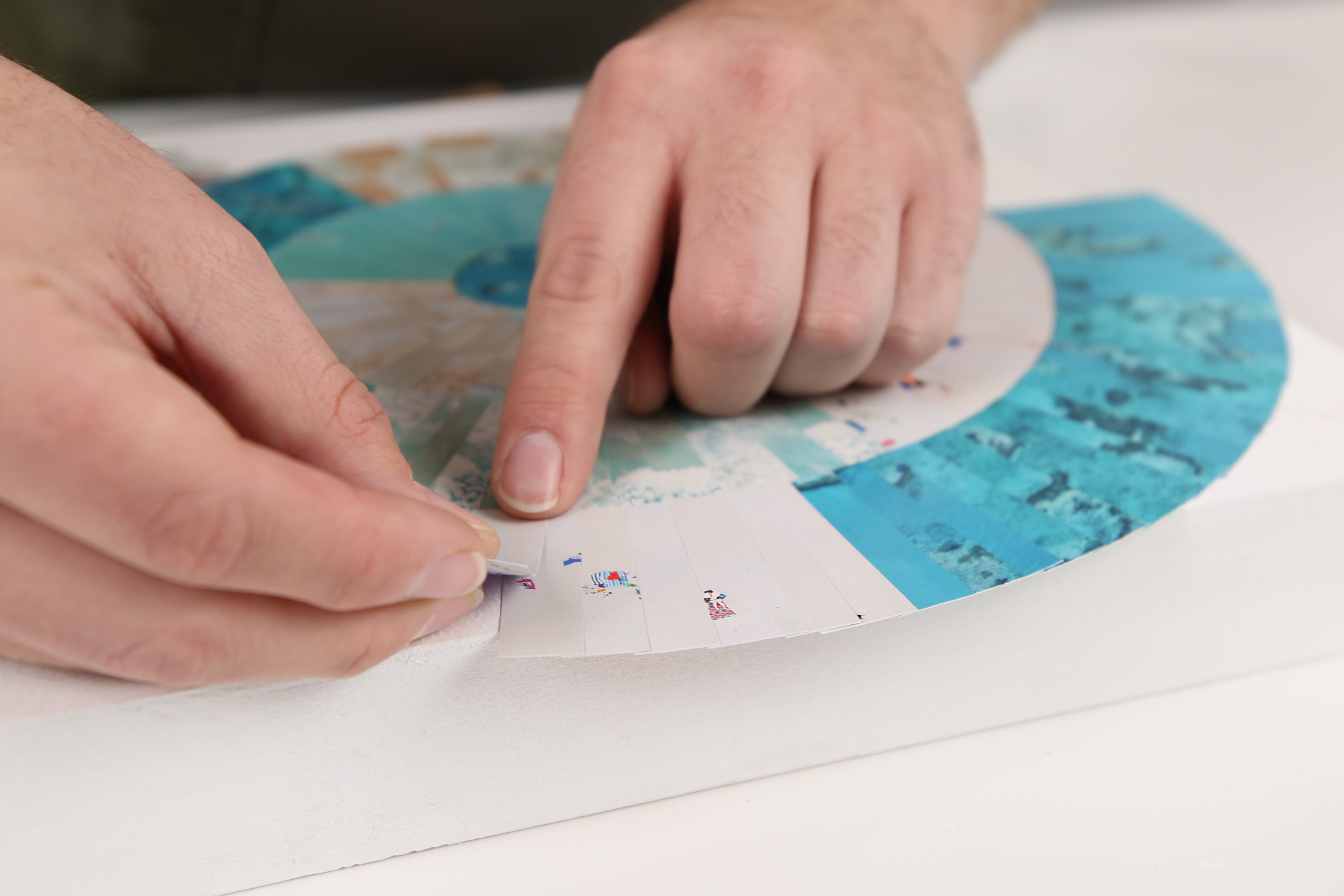 how to resin paper collage art: change up the pattern and color of the paper to create visual interest