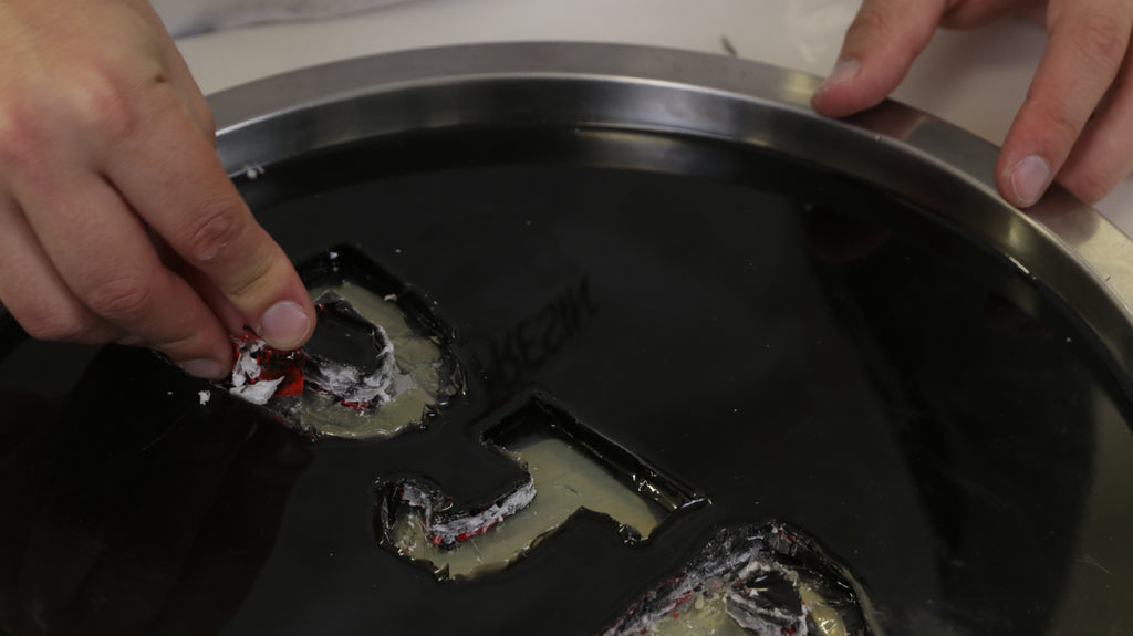 Make A Custom Resin Tray - safely remove the tape covered letters from the tray