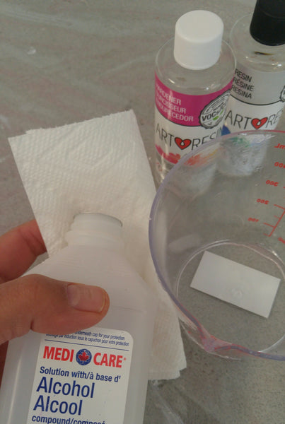 Cleaning Epoxy Resin Mixing Containers - pour a little rubbing alcohol or acetone on a paper towel