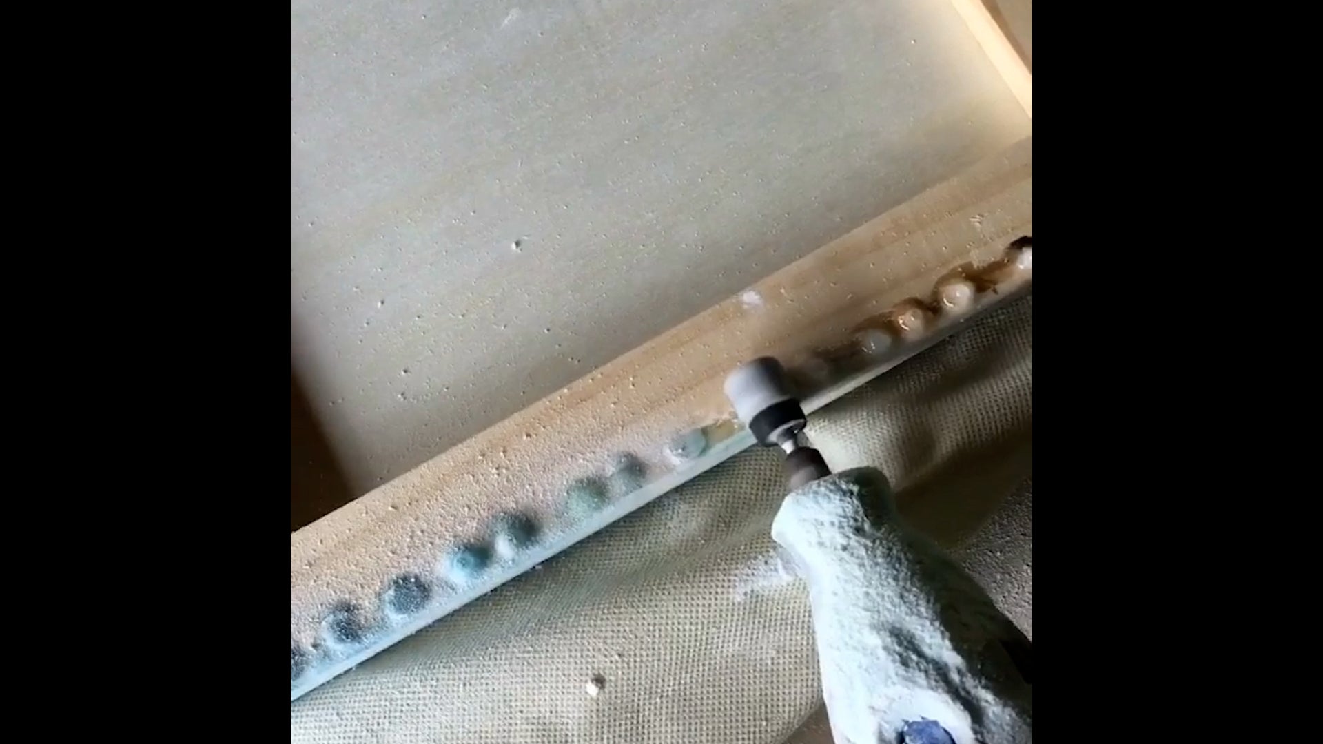 use a dremel to remove cured resin drips