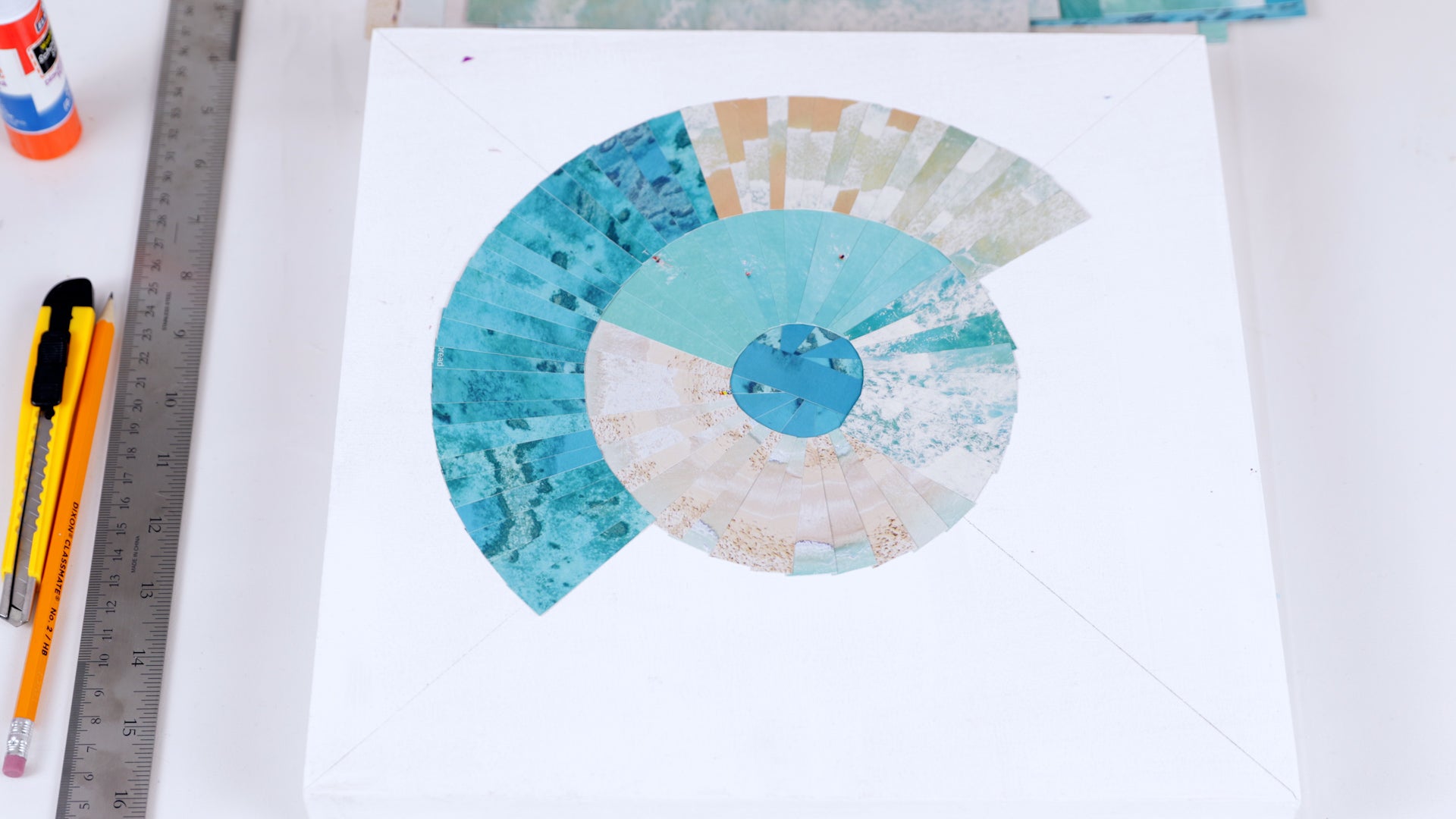 how to resin a paper collage: place lighter colors next to dark to balance out the collage