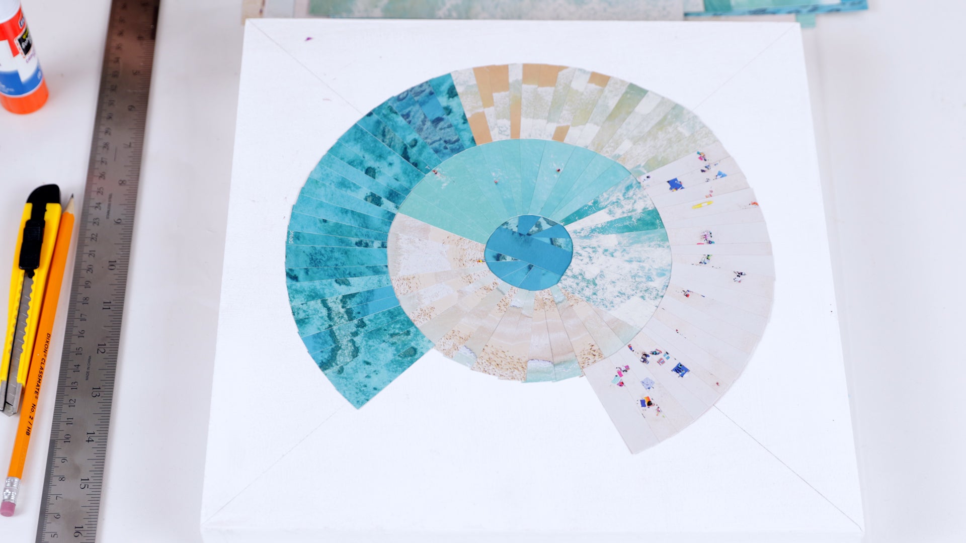 how to resin a paper collage: break up the pattern by mixing up the orientation as you lay down each strip