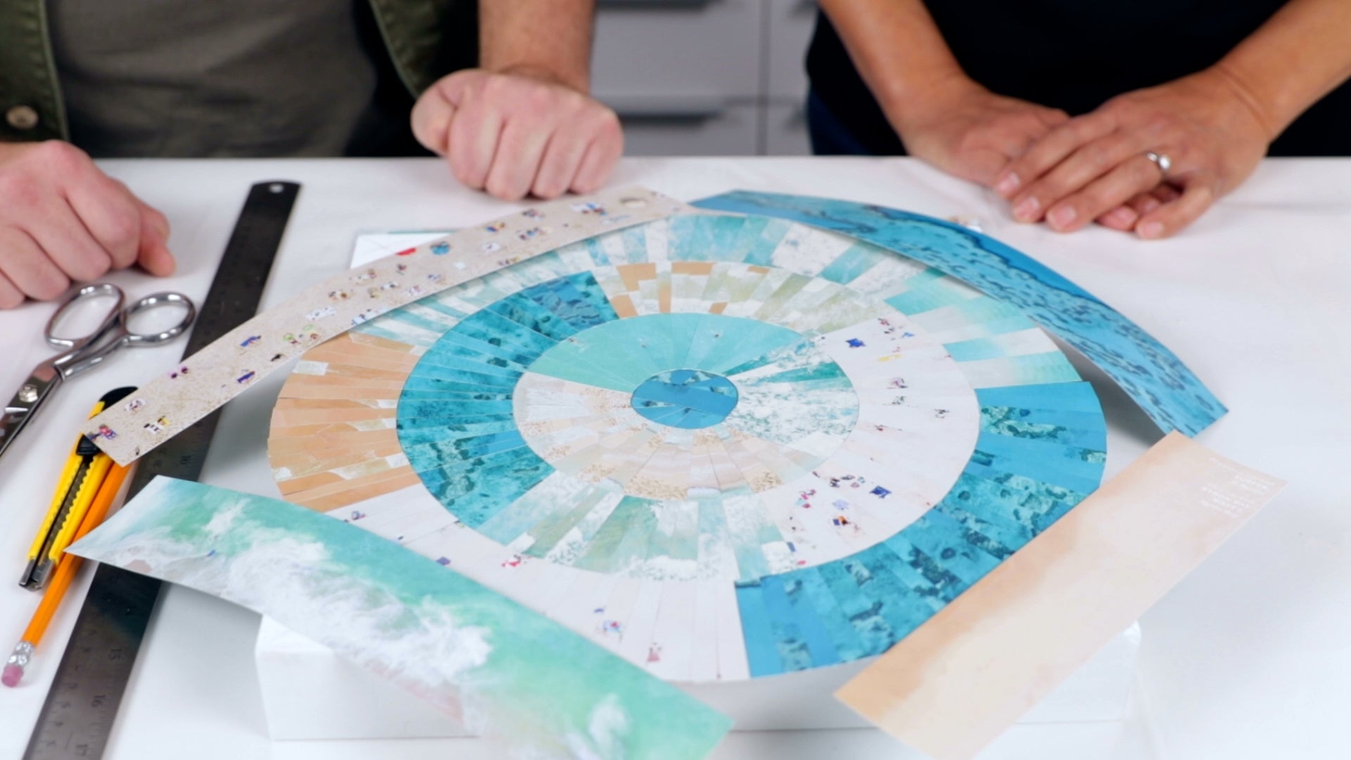 how to resin a paper collage: place strips of paper before gluing to determine placement