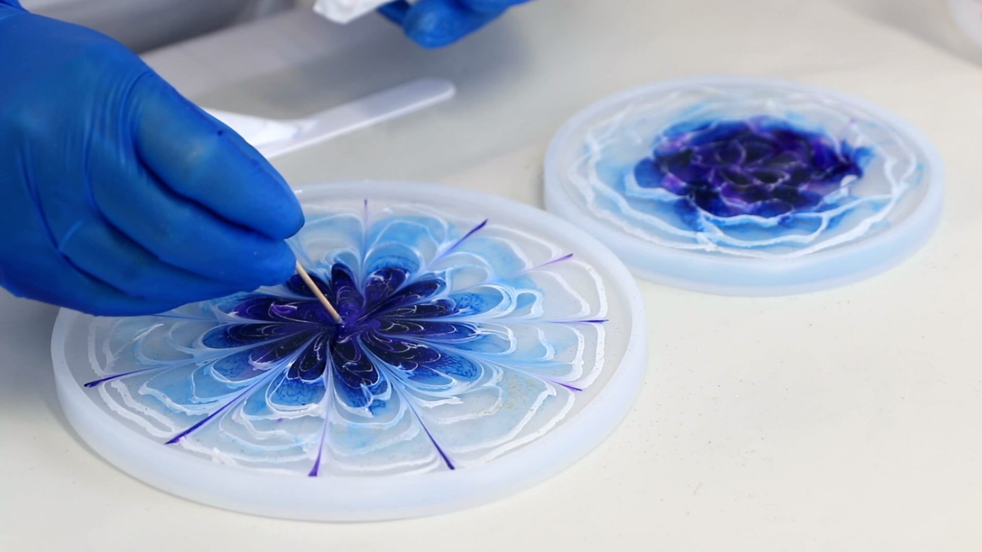 drag toothpick to make even lines throughout resin coaster to shape 3D flower petals