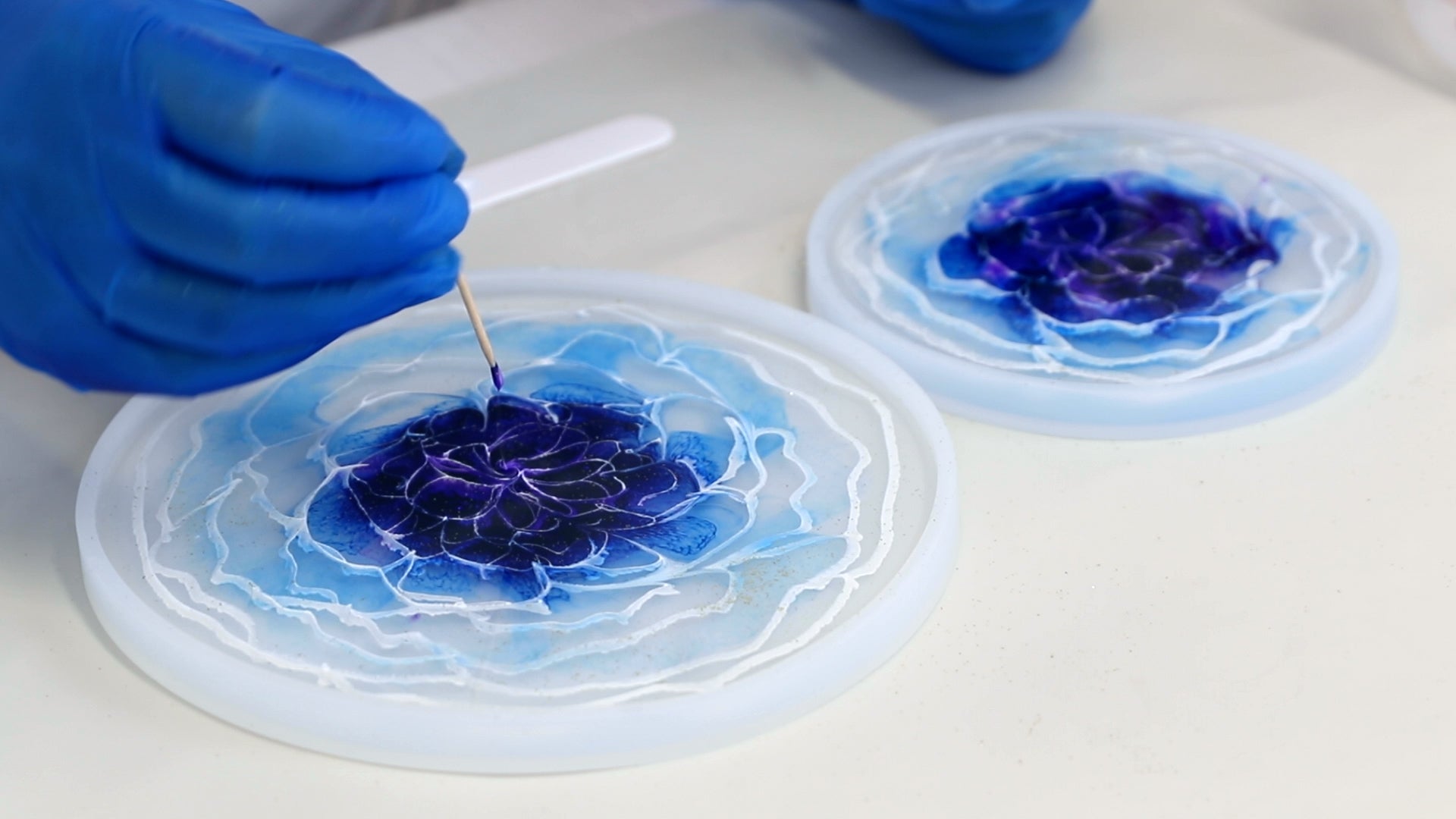 dip toothpick in centre of 3D resin flower to shape the petals