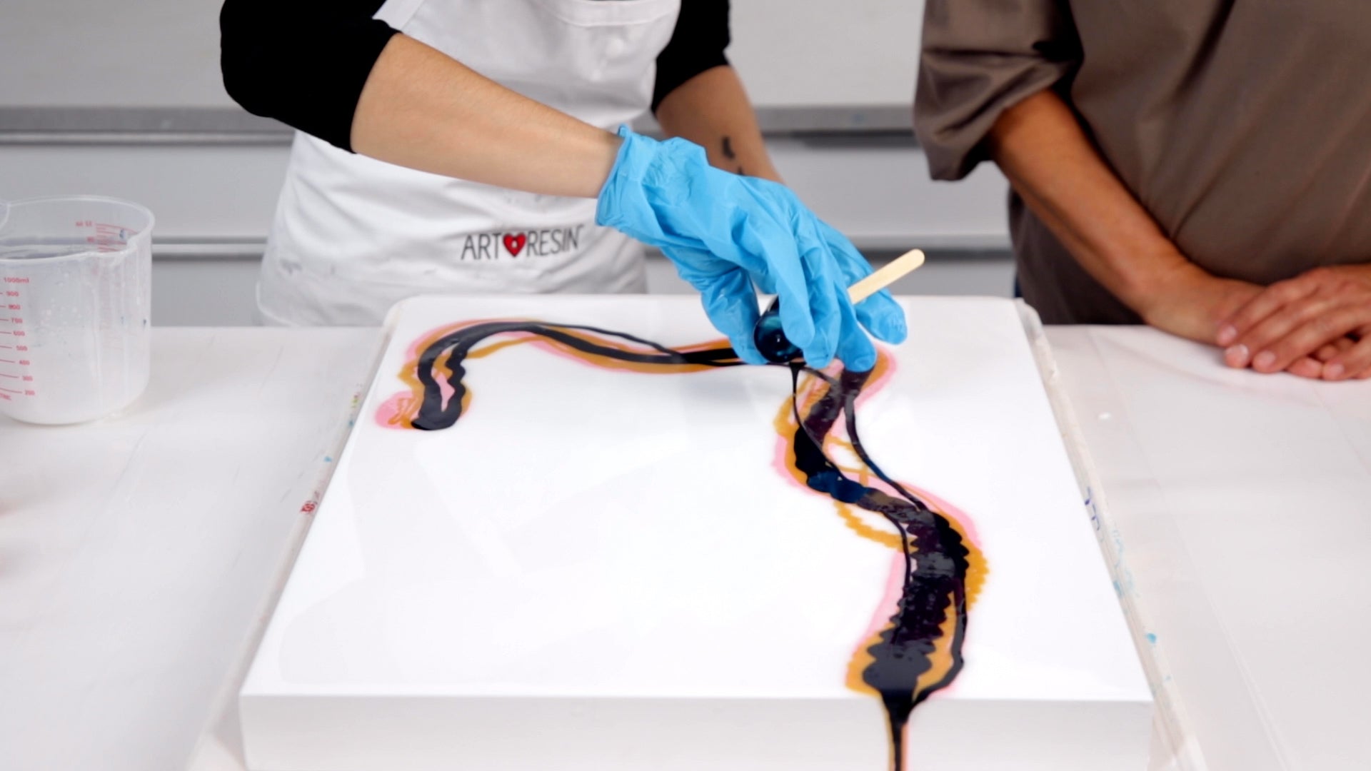 overlap acrylic paint medium to create cells in dutch pour painting technique