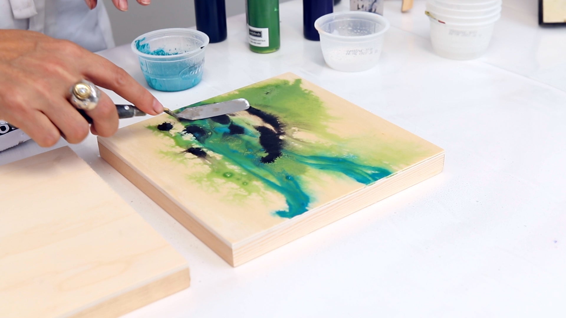 use a palette knife to pull paint across the panel for mixed media painting