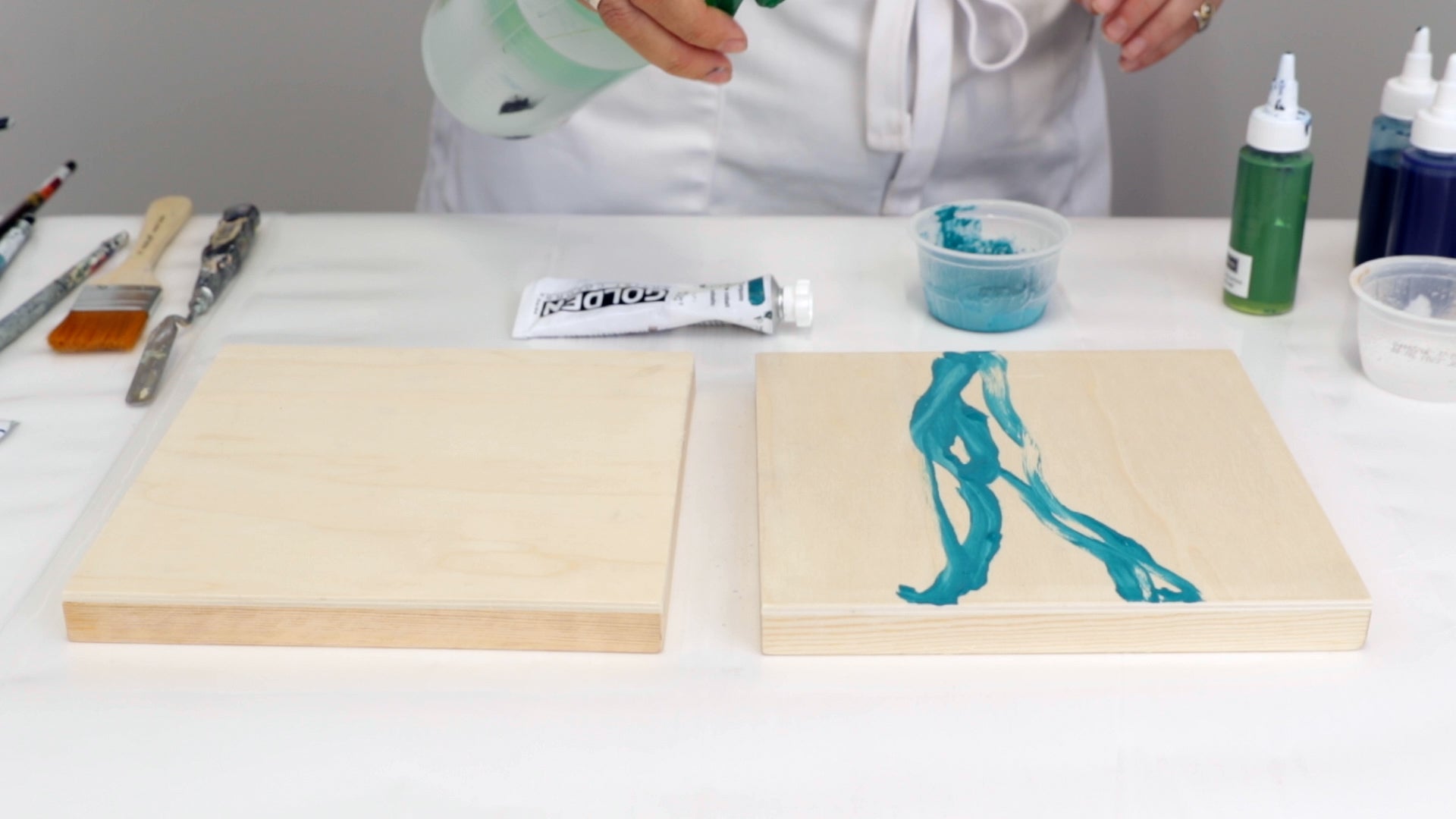 spritz water onto wet acrylic paint to help it spread across the panel