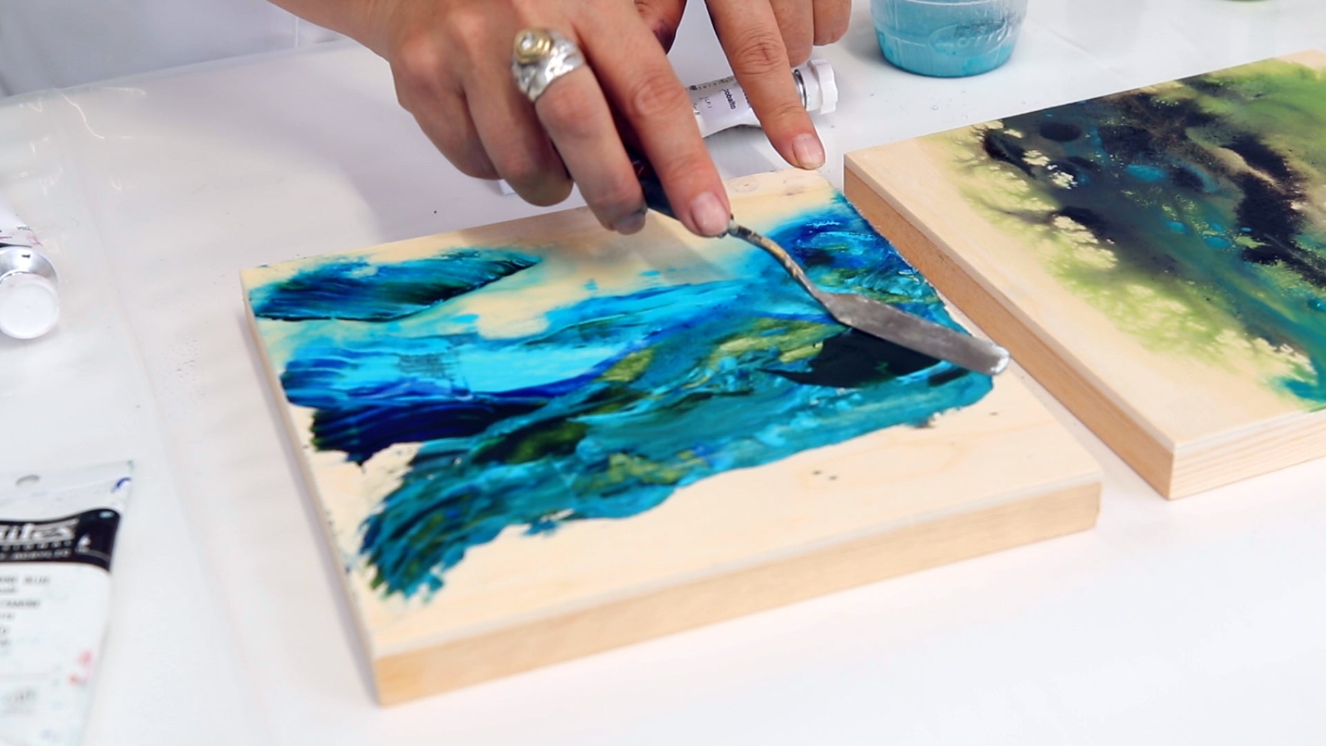 use a palette knife to work in and blend acrylic paint