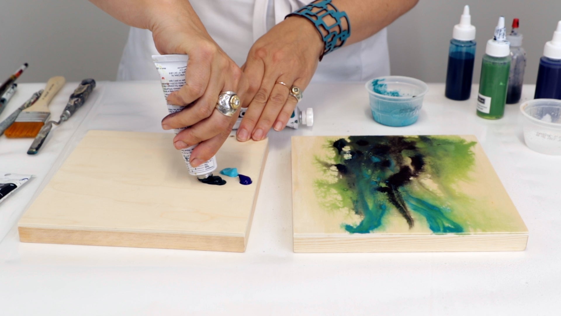 add dabs of acrylic paint directly onto wood panel to start mixed media painting