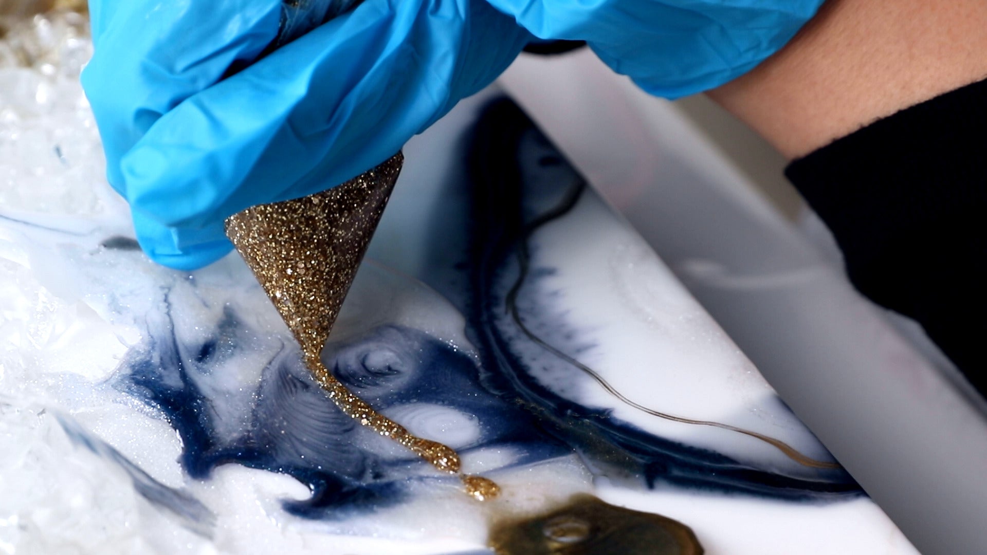 squeeze thin line of glitter resin onto geode art