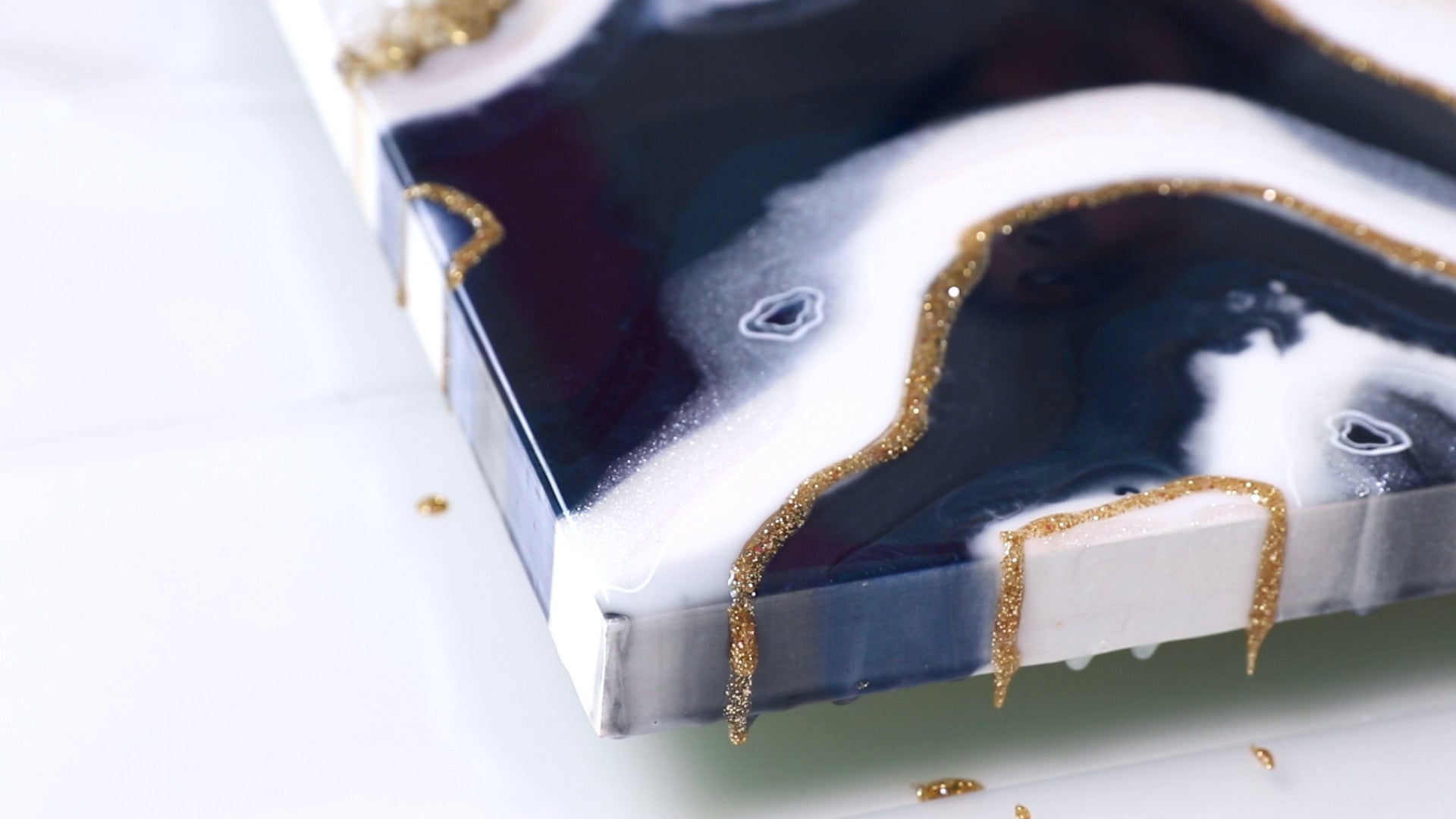 glitter resin carried onto sides of resin geode art