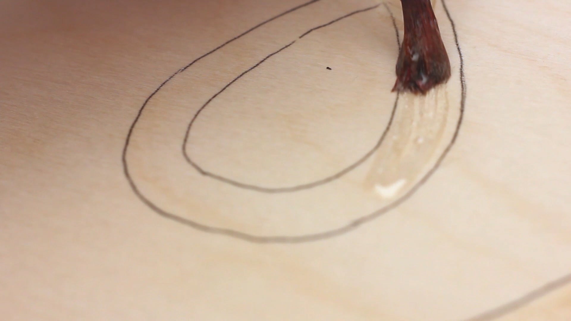 Resin Rocks – draw a design outline directly onto the wood panel