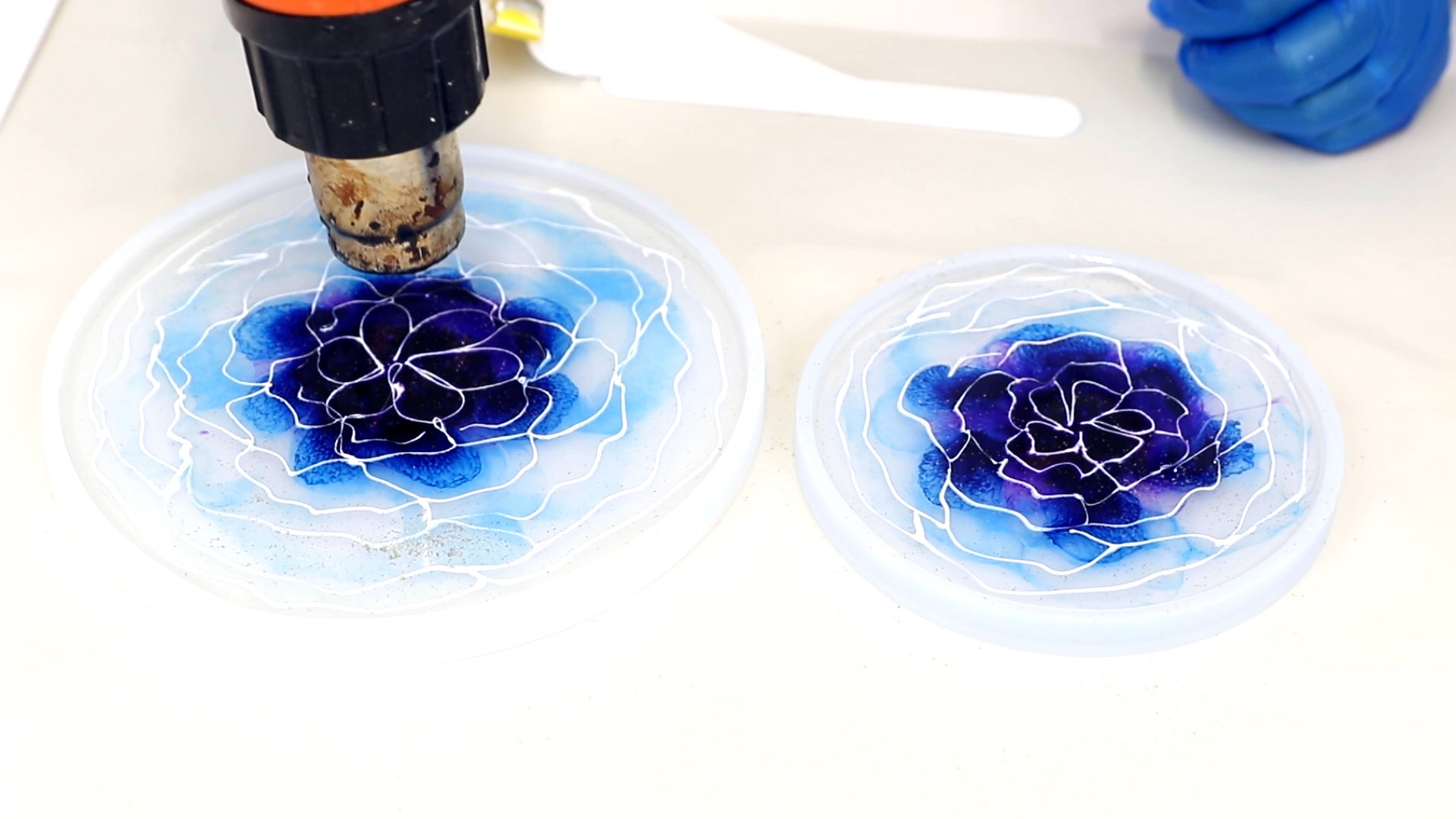 use heat gun to remove bubbles from 3D flower resin coaster