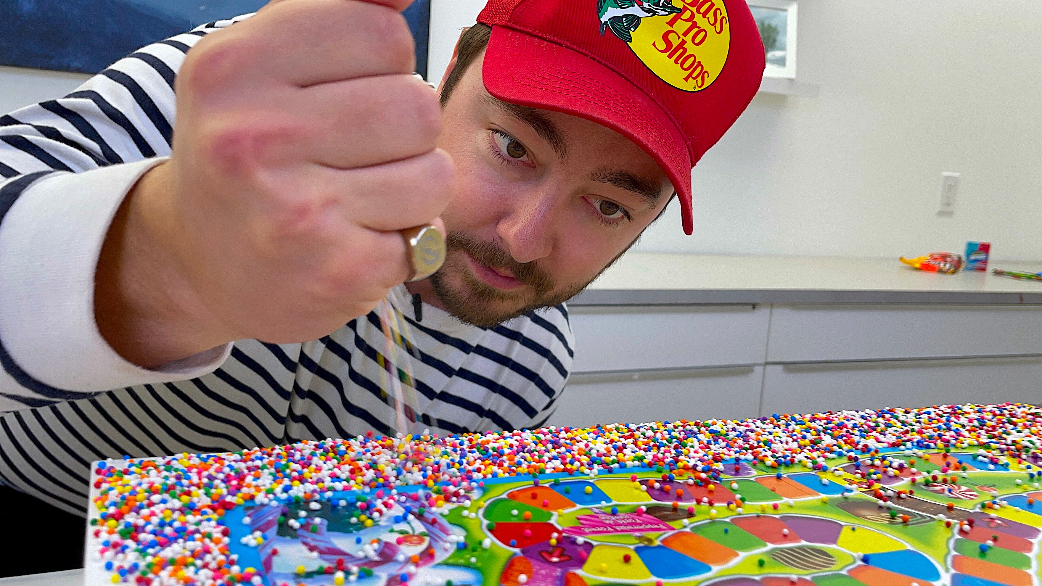 dropping candy sprinkles onto game board before resining