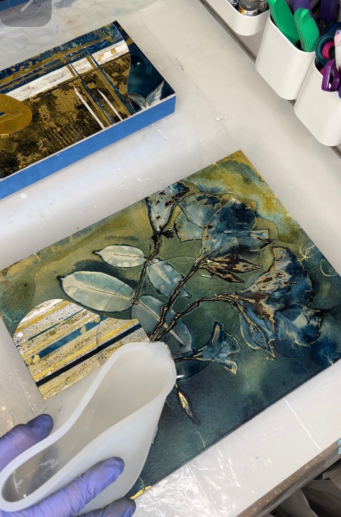 pouring resin on mixed media art