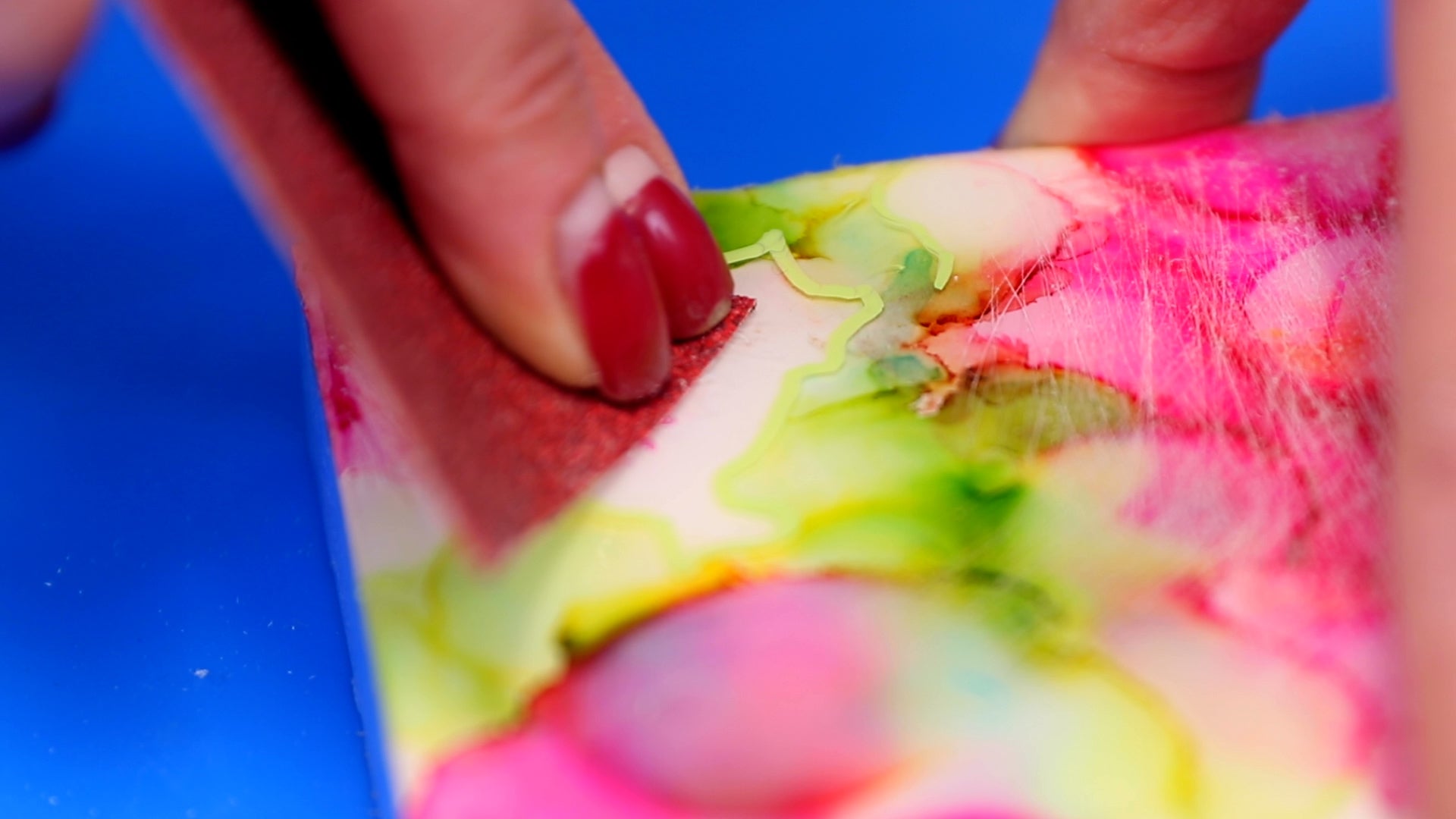 sand resin around paint before pouring a second layer of resin