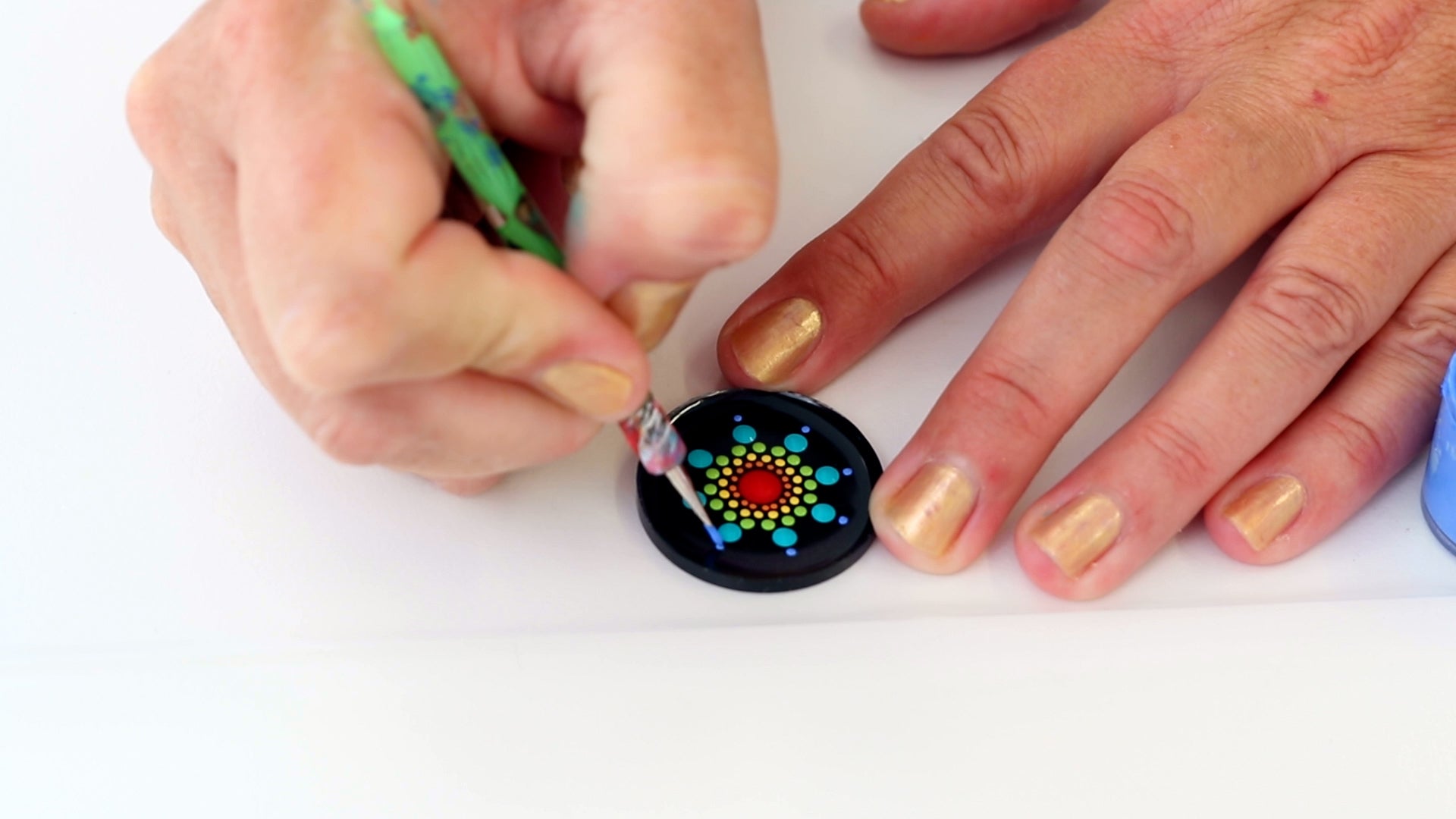 apply a single dot to create the peak dot of the mandala petal