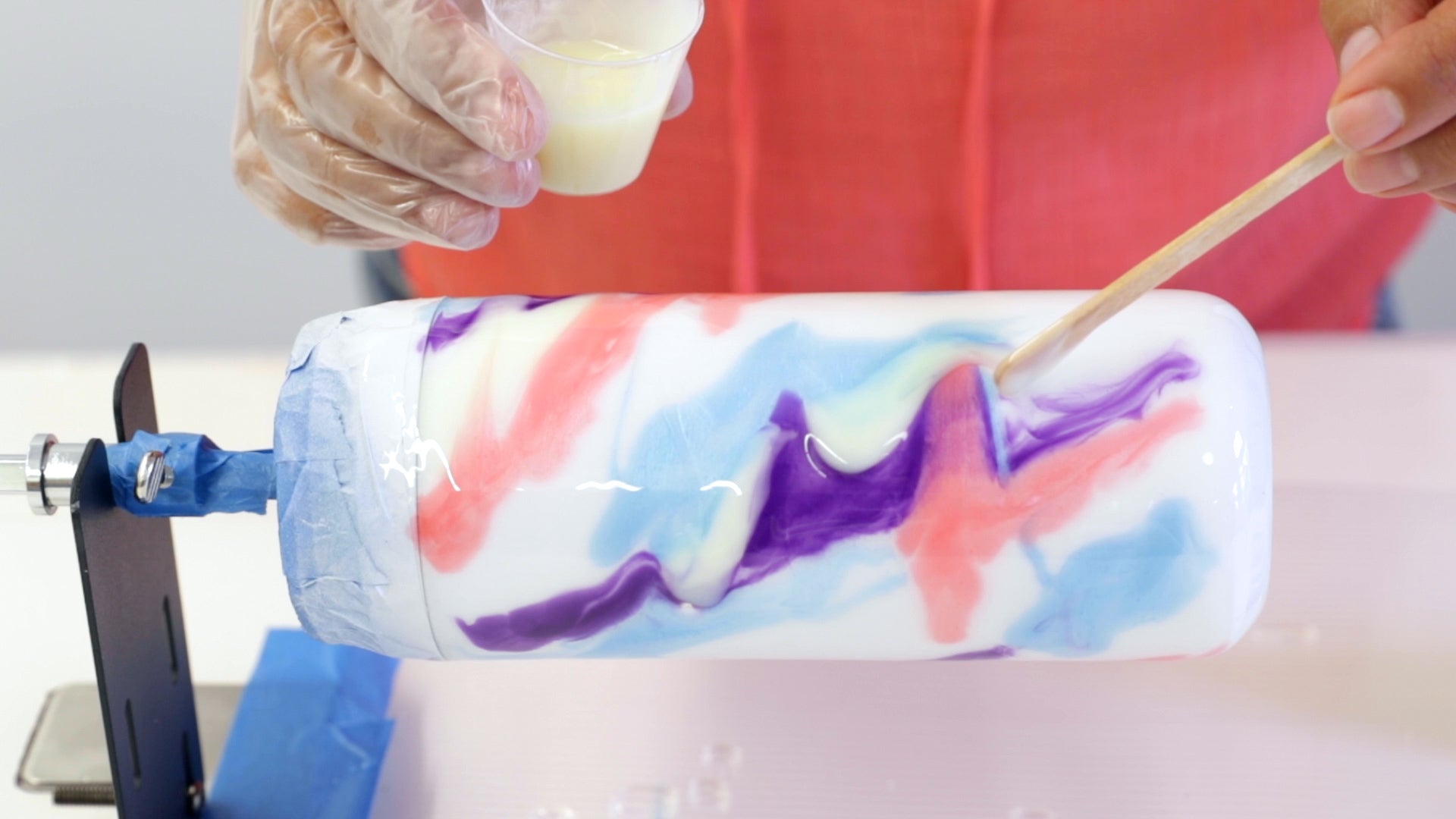Make A Resin Tumbler - slowly pour the ArtResin onto the surface of the tumbler as it turns
