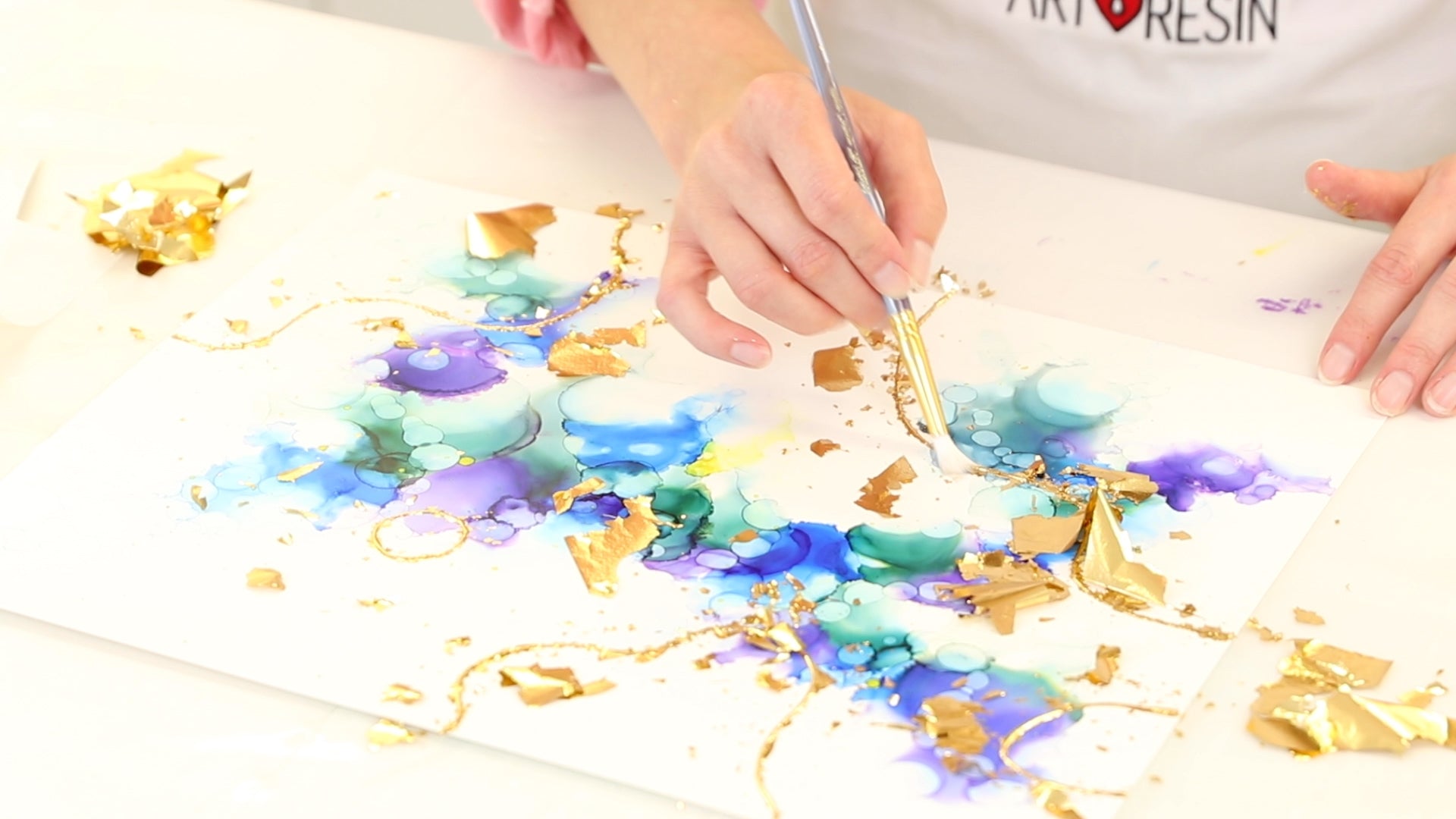 use mop brush to pull off excess gold leaf