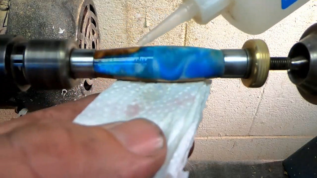 Make A Custom Resin Pen - Apply 3 coats of thin CA glue while the lathe runs