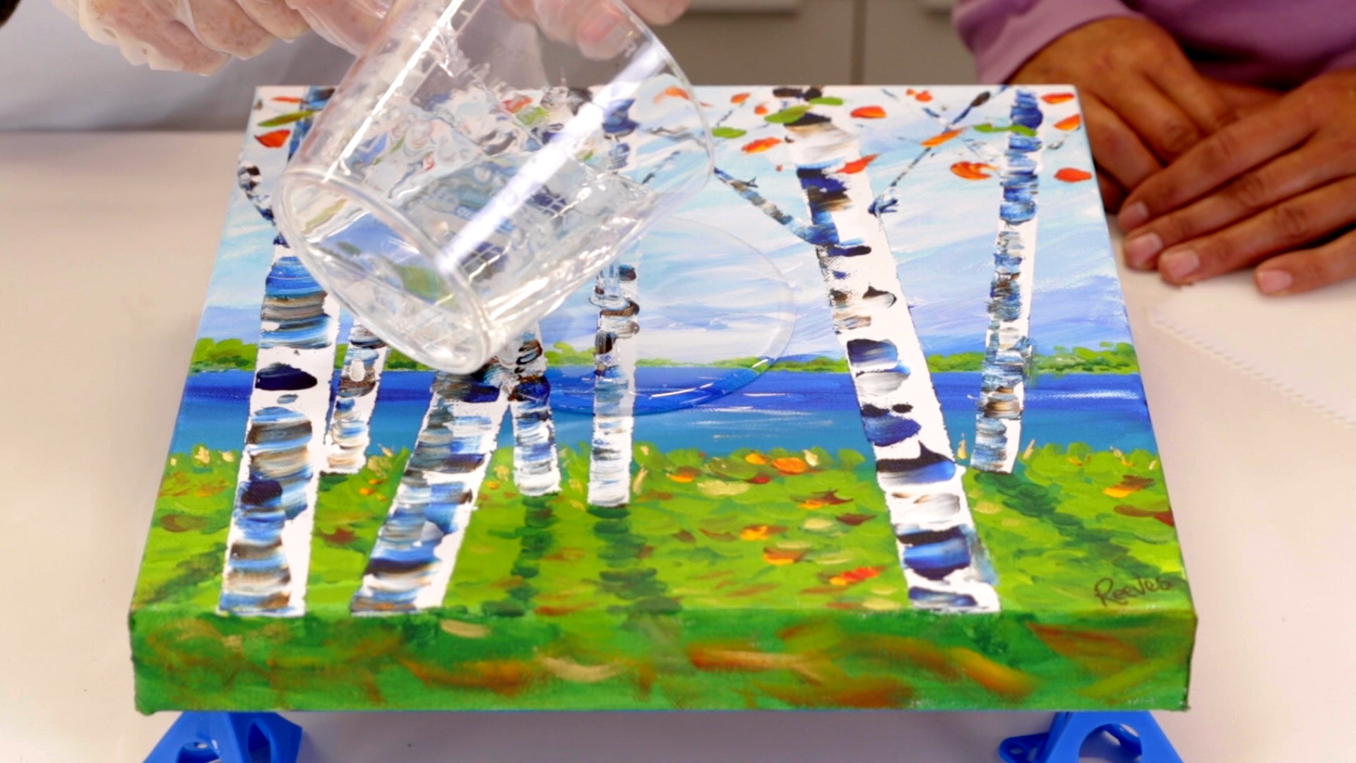 How to Resin a Canvas for Beginners: Pour the mixed ArtResin onto the centre of your piece