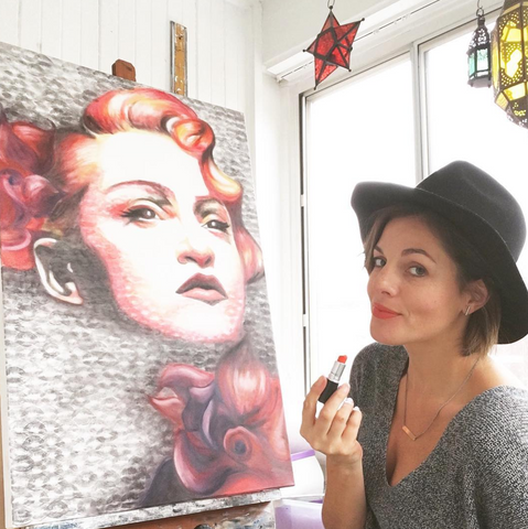 ArtResin - Alexis Fraser applying lipstick to literally kiss her canvases