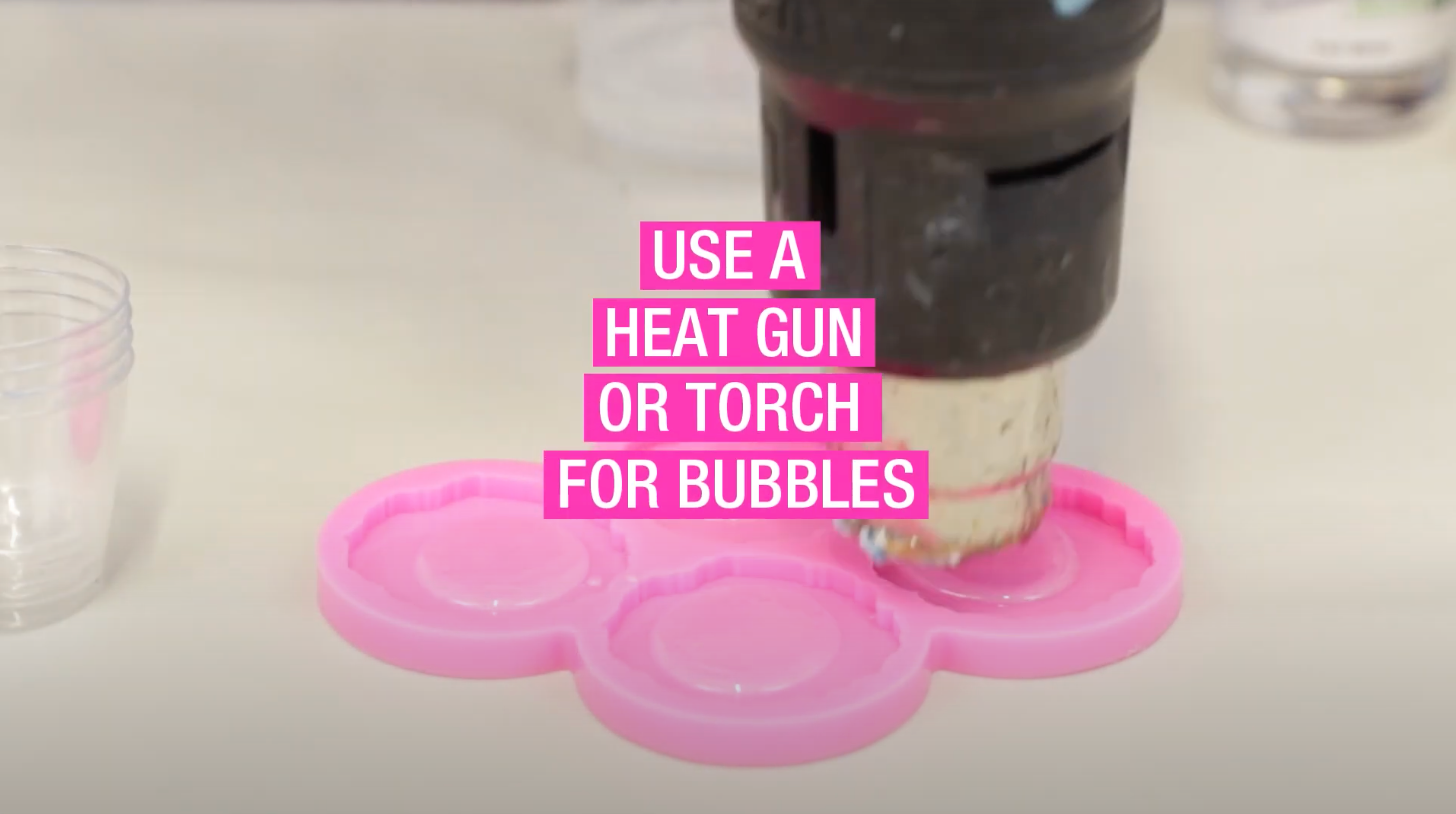 use a heat gun or a torch to zap bubbles from epoxy resin
