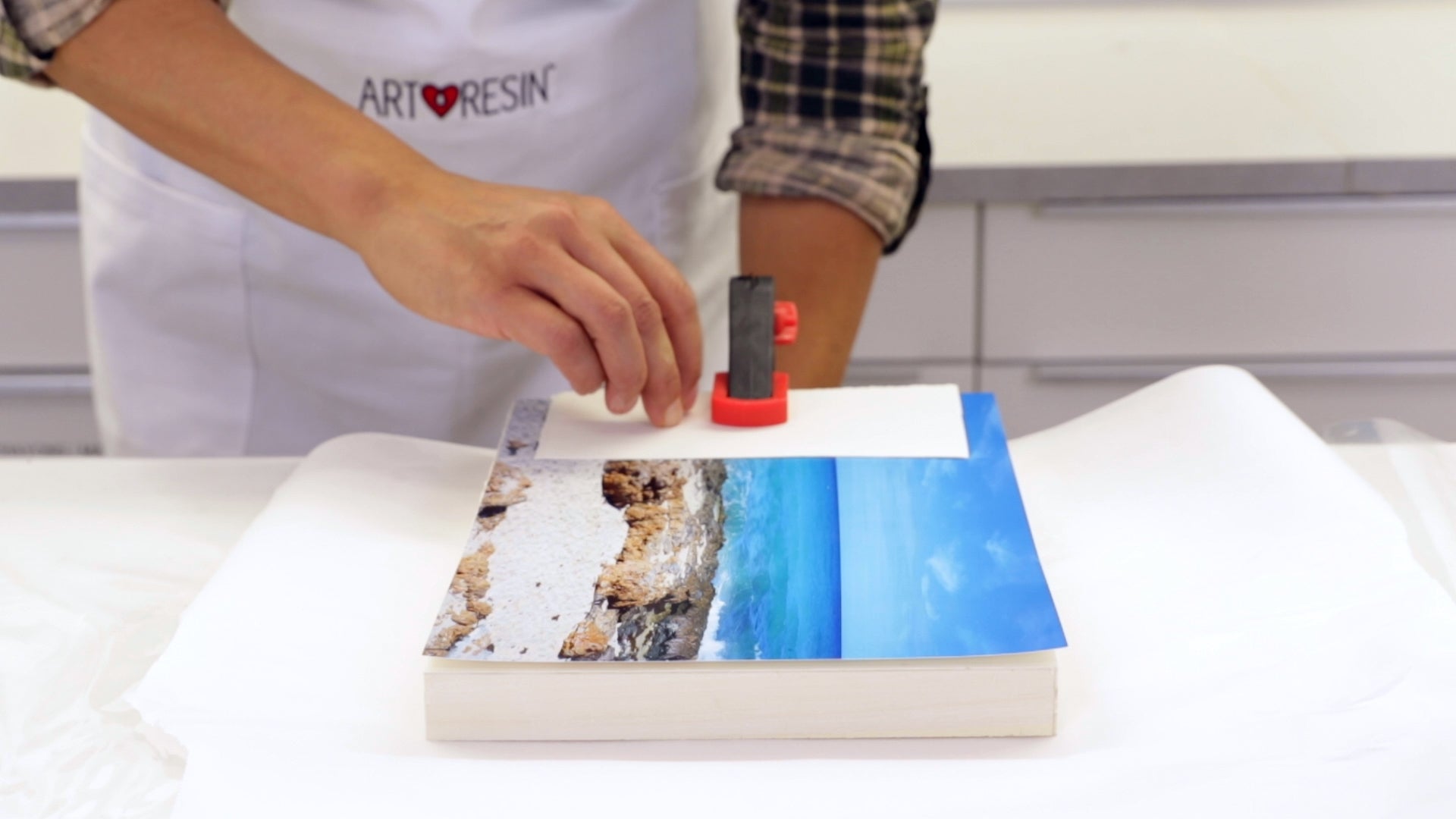 Tips To Prevent Resin Bubbles- place a clean piece of paper under the clamp to protect your print