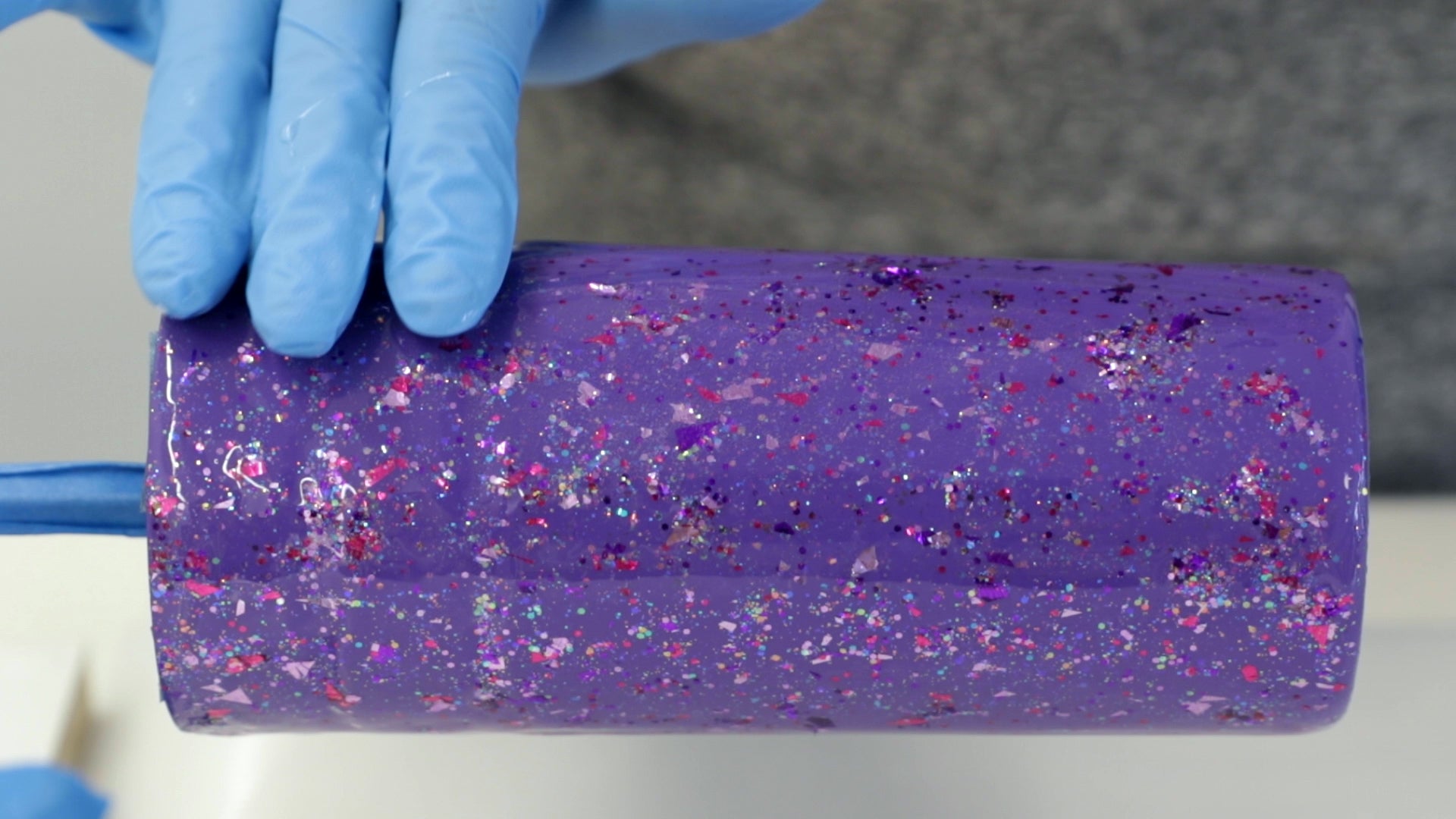 Make A Resin Tumbler - generously sprinkle the glitter over the entire surface