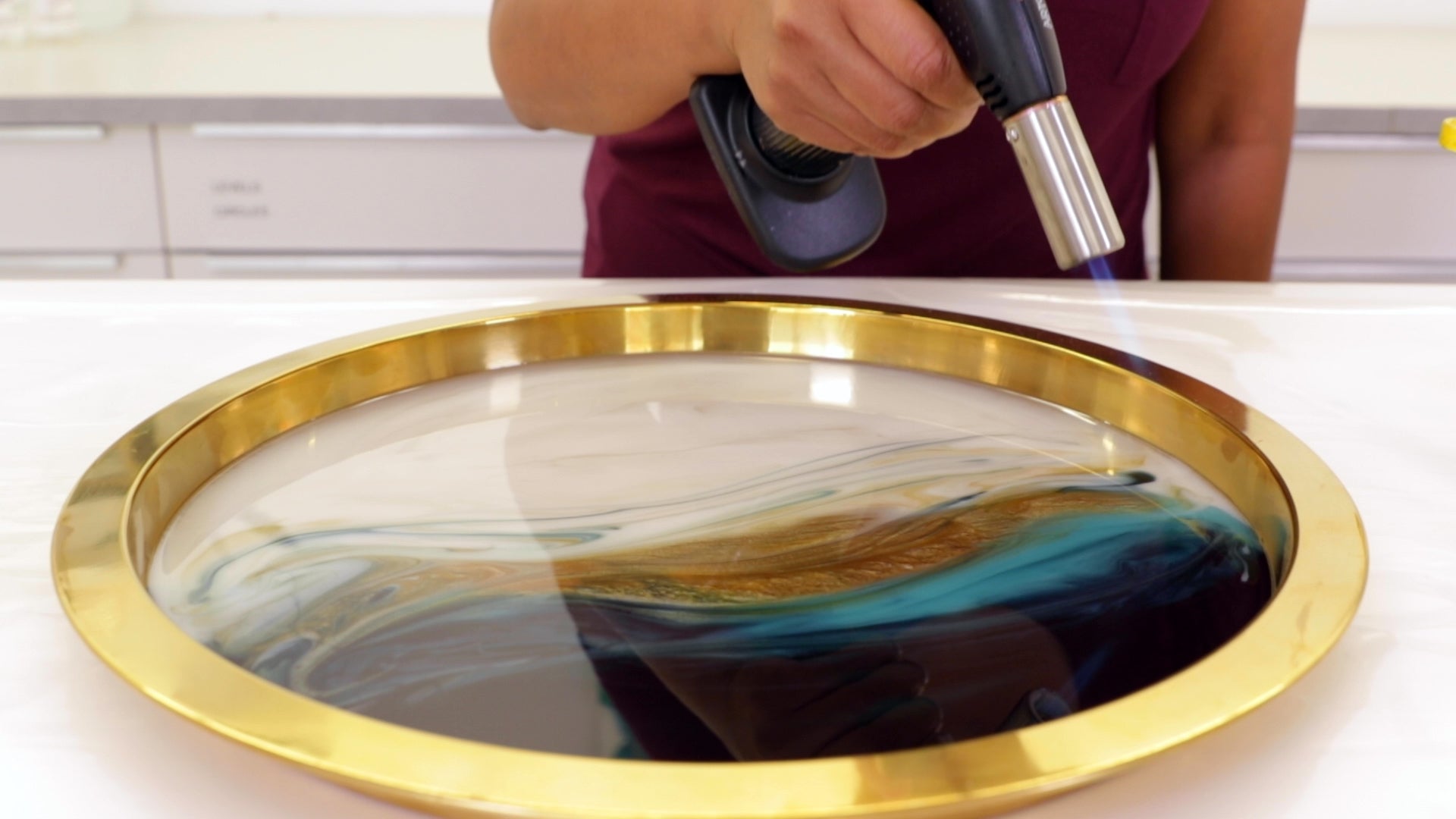 Create Resin Flow Art - Lightly run the torch over your design