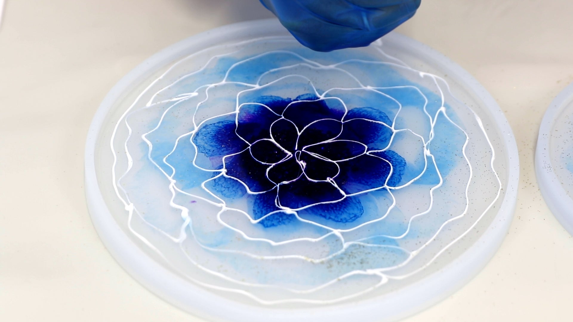 add last row of white petals into clear resin
