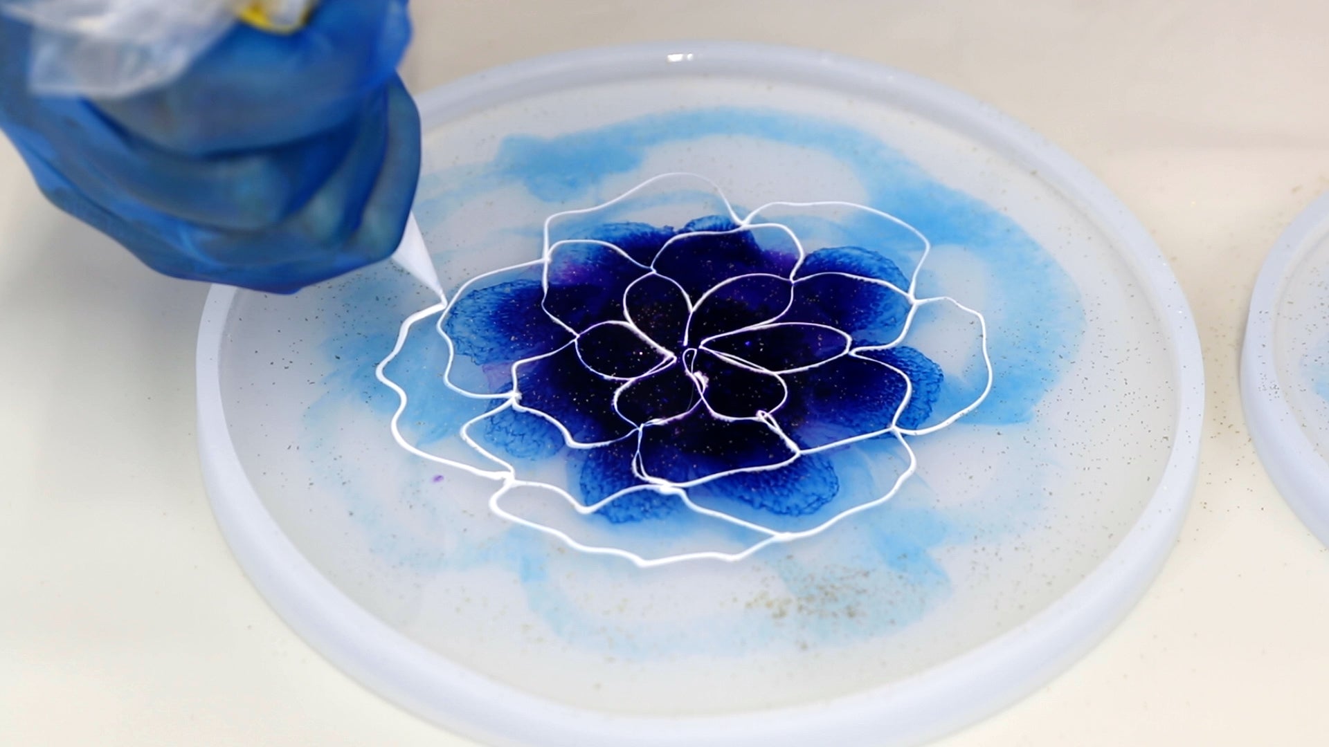 create a second and third row of petals with white resin