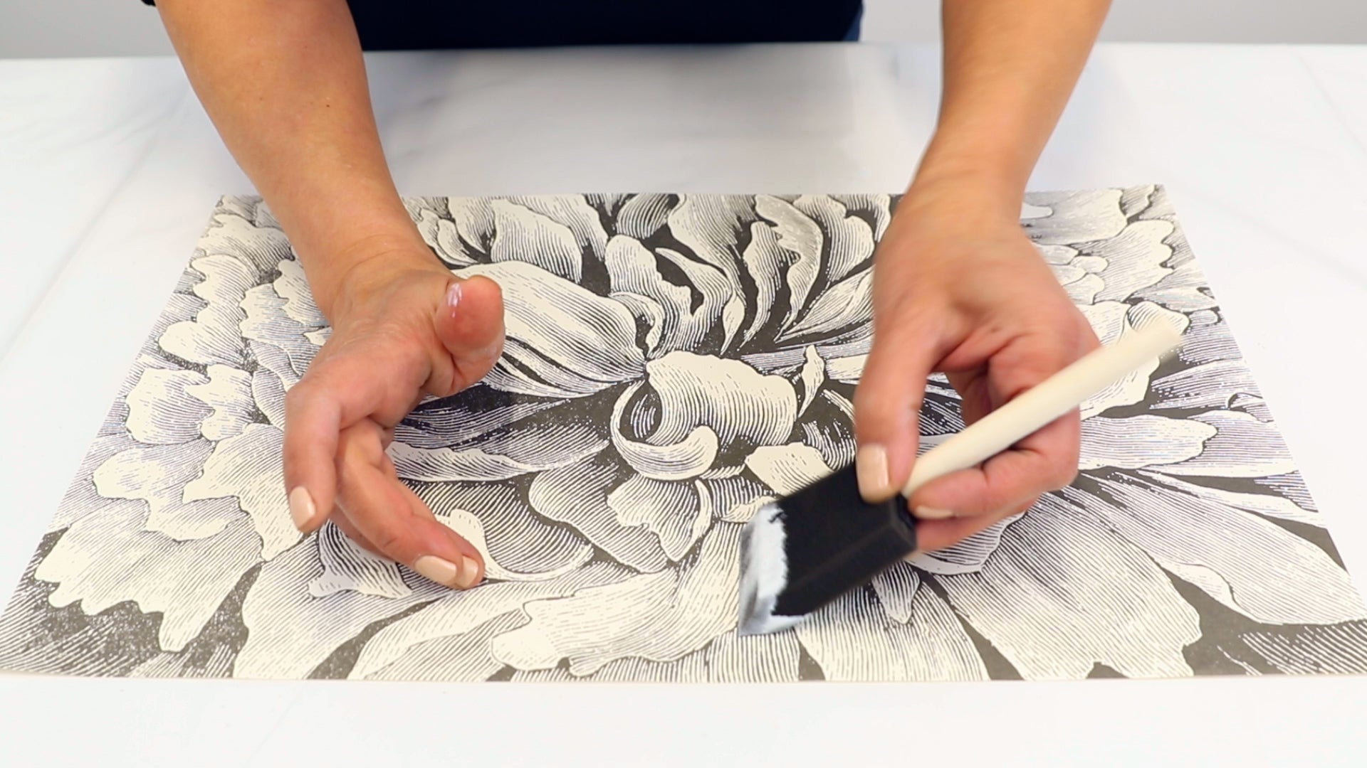 apply brush on sealant to artwork using a foam brush